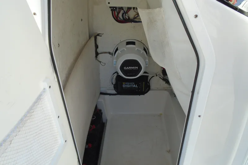 Slide: The Image of 2023 Sea Hunt BX 22 BR boat interior with Garmin electronics and Minn Kota digital charger. - 21