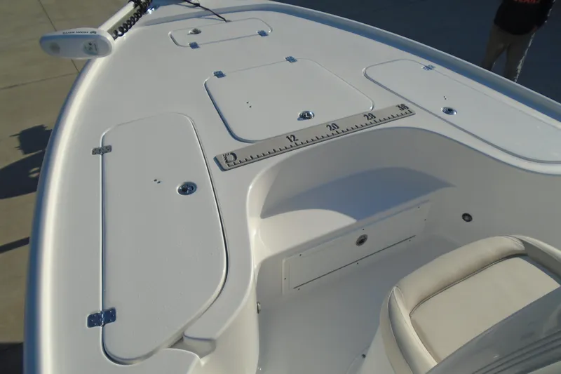 Slide: The Image of 2023 Sea Hunt BX 22 BR boat deck with storage compartments and measuring ruler. - 22