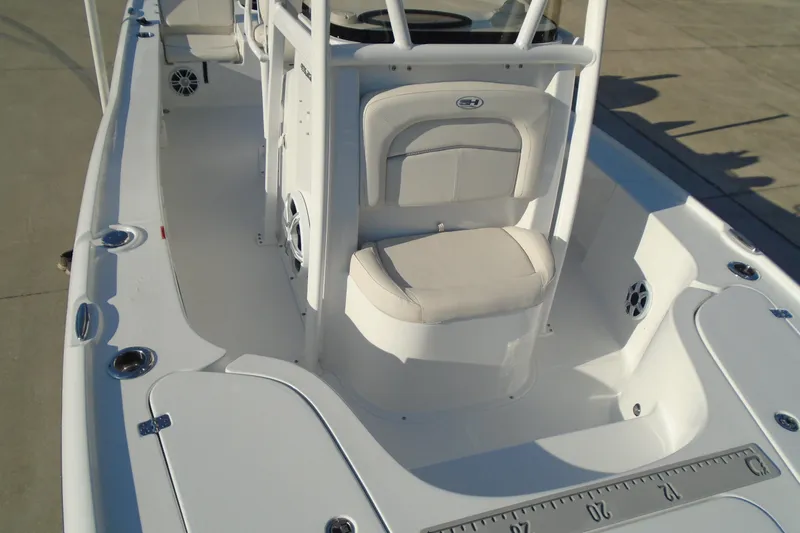 Slide: The Image of 2023 Sea Hunt BX 22 BR boat interior with seating and console. - 24