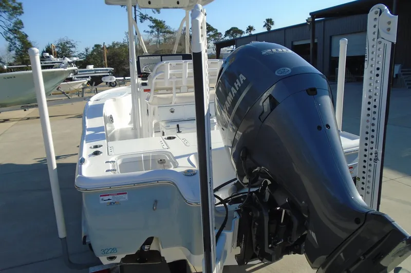 Slide: The Image of 2023 Sea Hunt BX 22 BR boat with Yamaha outboard motor, docked outdoors. - 9