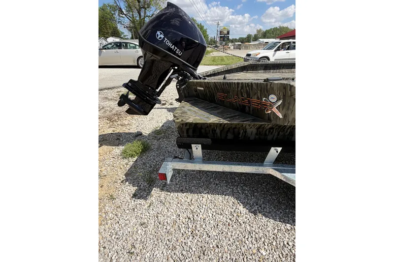 Slide: The Image of 2026 SeaArk 1960 Slayer X boat with Tohatsu motor on trailer. - 11