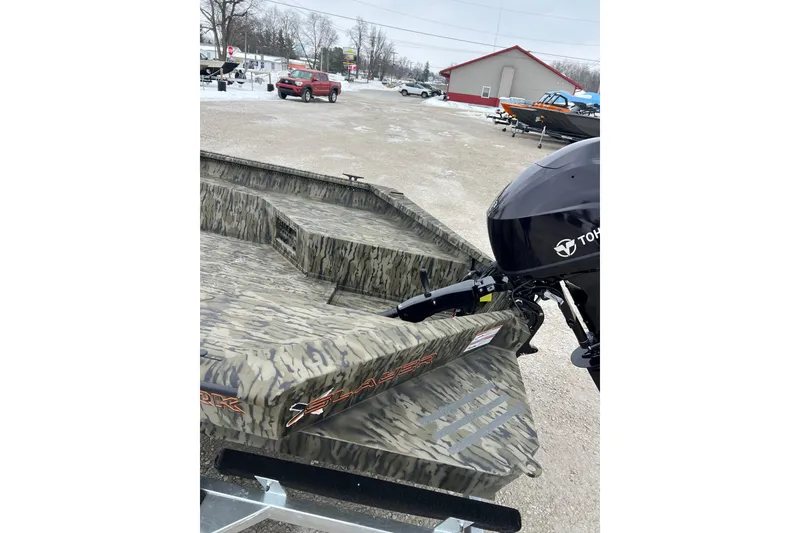 Slide: The Image of 2026 SeaArk 1960 Slayer X boat with camouflage design and Tohatsu outboard motor. - 7