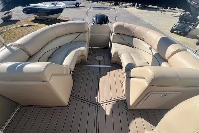 Slide: The Image of 2013 South Bay 722RS pontoon boat with spacious beige seating and sleek deck design. - 11