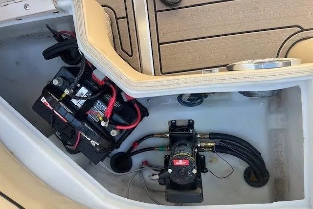 Slide: The Image of Battery and pump system in 2013 South Bay 722RS boat compartment. - 14