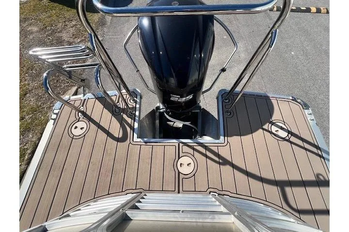 Slide: The Image of 2013 South Bay 722RS boat deck with motor and stainless steel railings. - 19