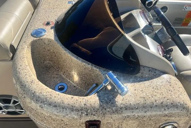 Slide: The Image of Dashboard of a 2013 South Bay 722RS boat with a built-in sink. - 8