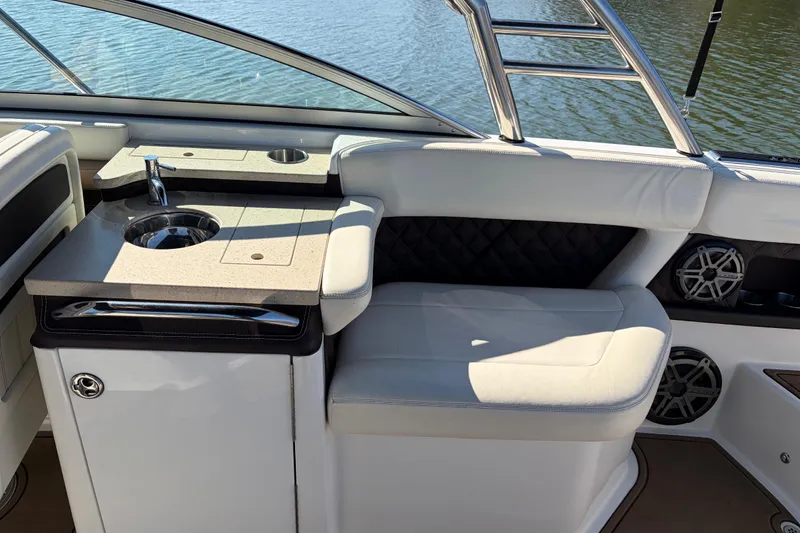 Slide: The Image of Luxurious interior of 2012 Cobalt A28 boat with seating and sink area. - 12