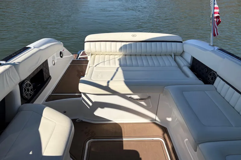 Slide: The Image of Luxurious interior of 2012 Cobalt A28 boat with white leather seating and American flag. - 13