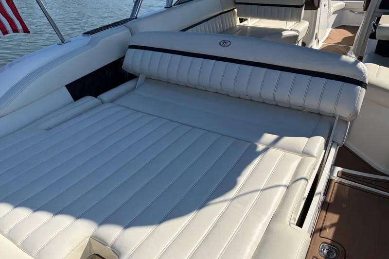 Slide: The Image of Luxurious seating on a 2012 Cobalt A28 boat with white upholstery. - 14