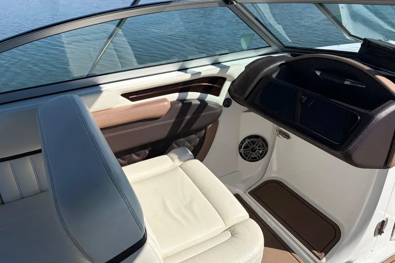 Slide: The Image of Interior of 2012 Cobalt A28 boat with leather seating and dashboard details. - 17