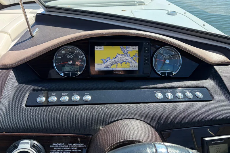 Slide: The Image of Dashboard of a 2012 Cobalt A28 boat with navigation system and gauges. - 19