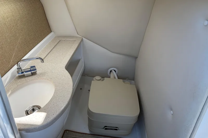 Slide: The Image of Compact bathroom in 2012 Cobalt A28 boat with sink and portable toilet. - 22