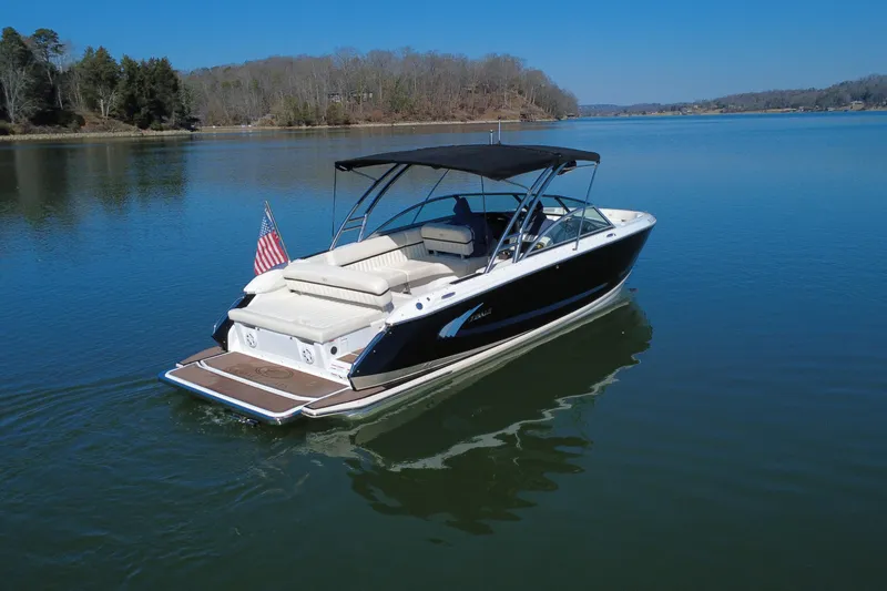 Slide: The Image of 2012 Cobalt A28 boat on a serene lake with clear blue skies. - 9