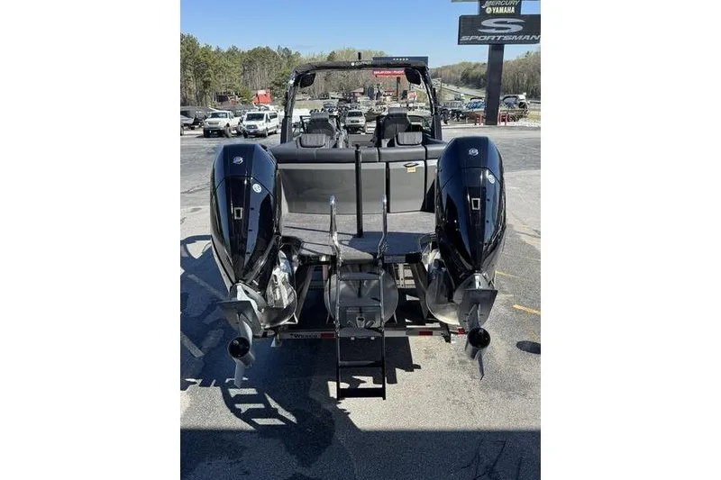 Slide: The Image of 2026 Godfrey Sanpan 2700 ULW pontoon boat with dual outboard motors, rear view. - 13