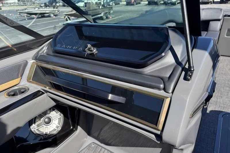 Slide: The Image of 2026 Godfrey Sanpan 2700 ULW boat dashboard with speaker and storage compartment. - 19