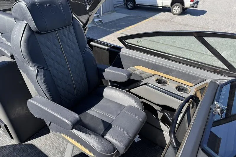 Slide: The Image of Luxurious seating in 2026 Godfrey Sanpan 2700 ULW boat, featuring cup holders and sleek design. - 26