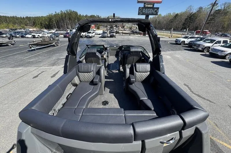 Slide: The Image of 2026 Godfrey Sanpan 2700 ULW pontoon boat with luxurious seating in a parking lot. - 33