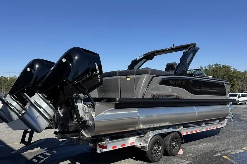 Slide: The Image of 2026 Godfrey Sanpan 2700 ULW pontoon boat with dual Mercury engines on trailer. - 6