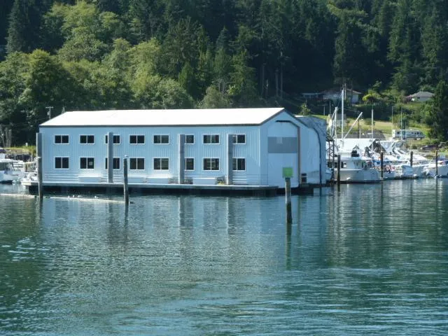 The Image of Floating boathouse in harbor, surrounded by forest, built in 2015. - 0