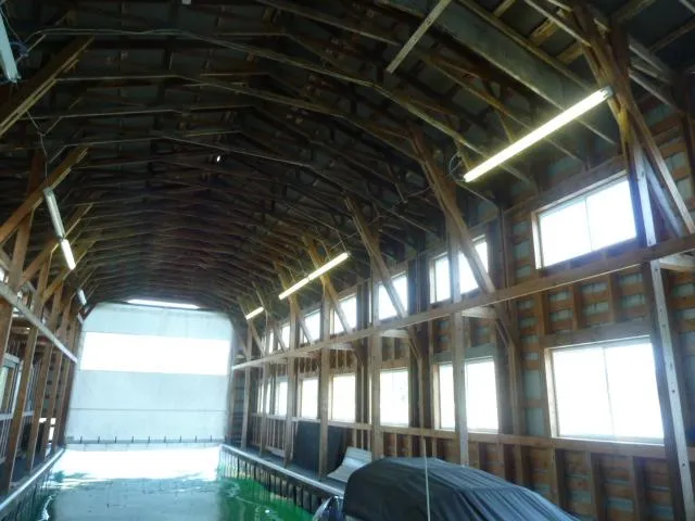Slide: The Image of Interior of a large boathouse with wooden structure, built in 2015. - 10