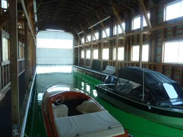 Slide: The Image of Interior of a Custom Boathouse with two boats, built in 2015. - 7