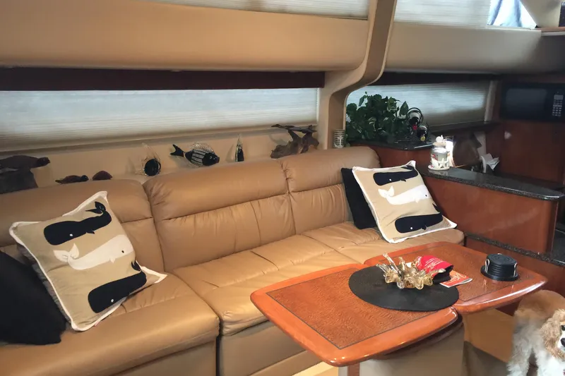 Slide: The Image of Luxurious interior of 2006 Meridian 408 Motoryacht with beige sofa and decorative pillows. - 13