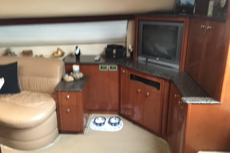 Slide: The Image of Luxurious interior of 2006 Meridian 408 Motoryacht with leather seating and entertainment center. - 16