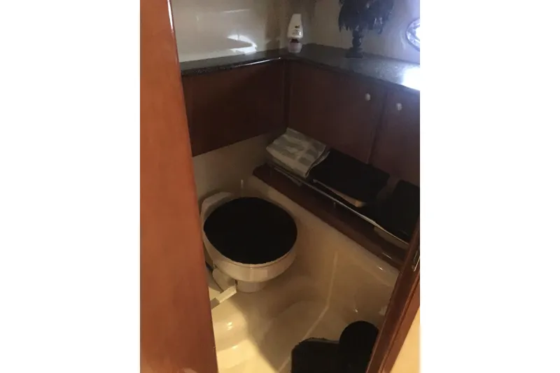 Slide: The Image of Bathroom interior of 2006 Meridian 408 Motoryacht with wooden cabinetry and toilet. - 20