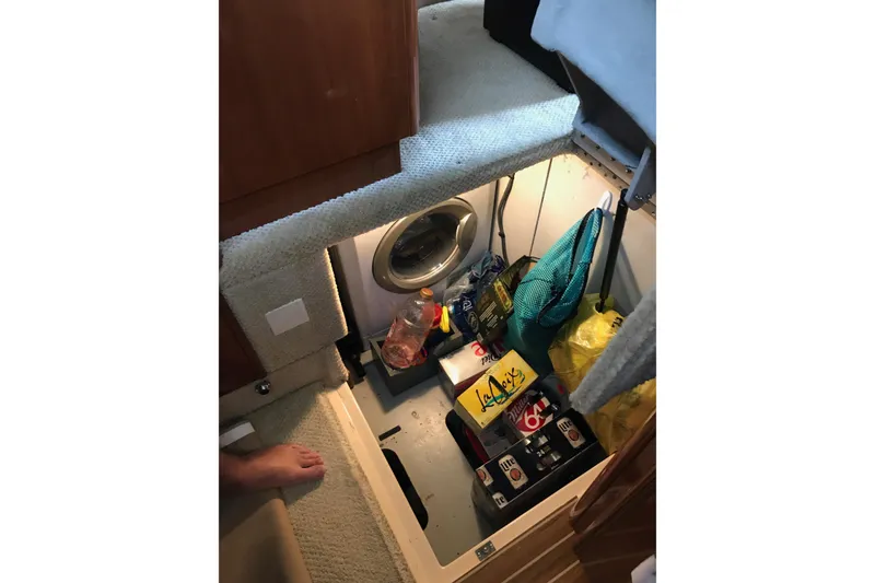 Slide: The Image of Storage compartment in 2006 Meridian 408 Motoryacht with beverages and supplies. - 22