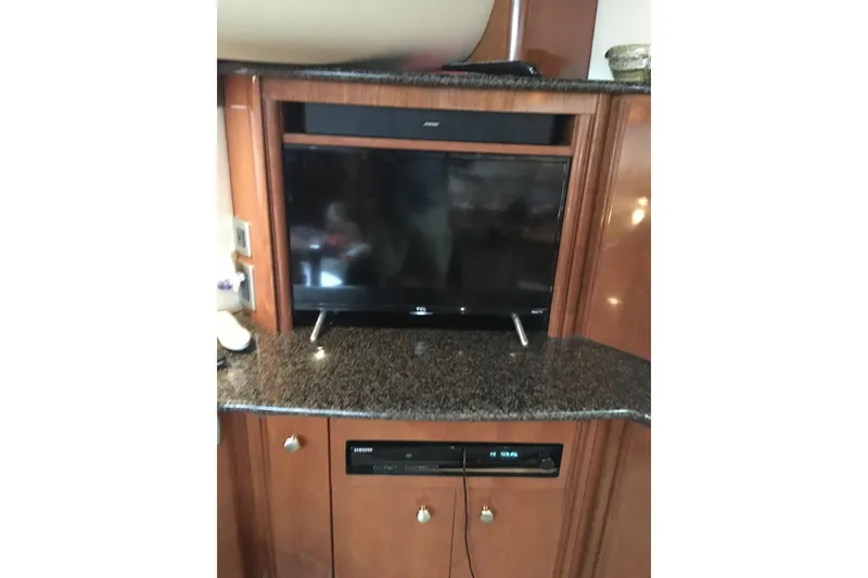 Slide: The Image of Entertainment center in 2006 Meridian 408 Motoryacht with TV and audio system. - 23