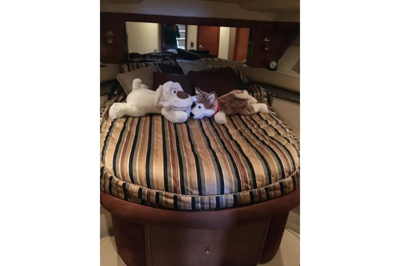 Slide: The Image of Luxurious 2006 Meridian 408 Motoryacht bedroom with plush toys on striped bedding. - 25