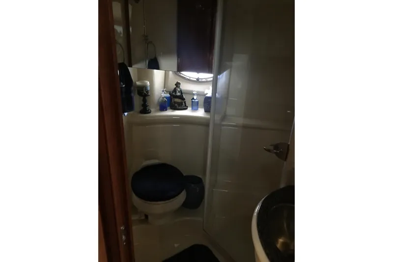Slide: The Image of Bathroom interior of a 2006 Meridian 408 Motoryacht, featuring a shower and decorative items. - 26