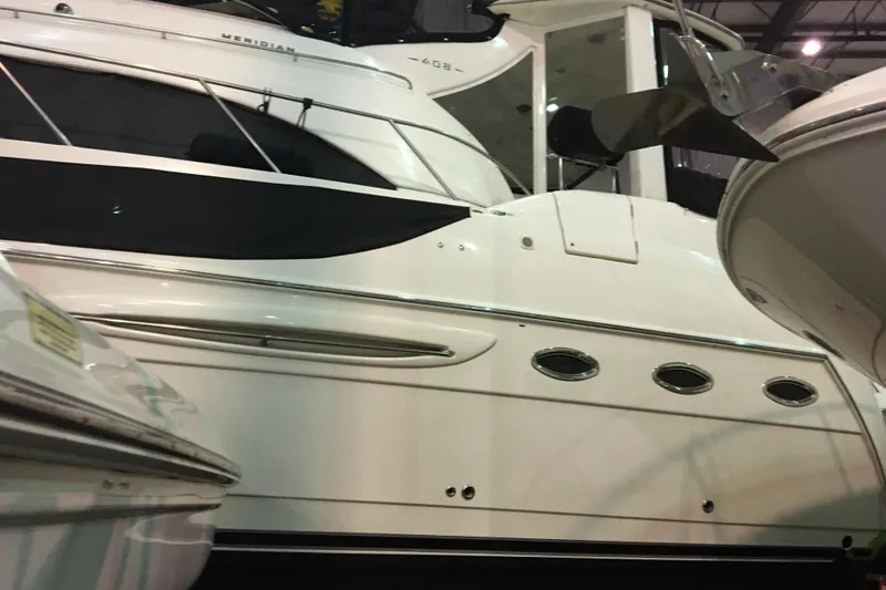 Slide: The Image of 2006 Meridian 408 Motoryacht in a showroom, showcasing sleek design and modern features. - 5