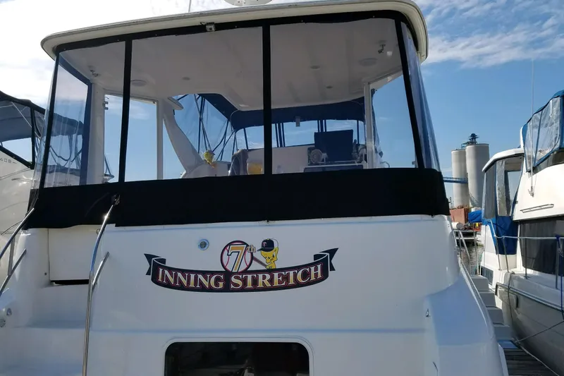 Slide: The Image of 2006 Meridian 408 Motoryacht named "7th Inning Stretch" docked at marina. - 7