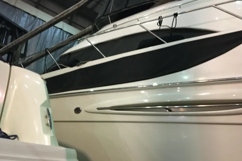 Slide: The Image of 2006 Meridian 408 Motoryacht in storage, showcasing sleek design and polished exterior. - 8