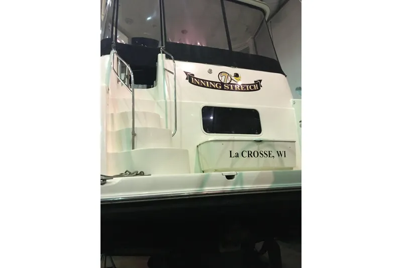 Slide: The Image of 2006 Meridian 408 Motoryacht docked, named "Inning Stretch," located in La Crosse, WI. - 9
