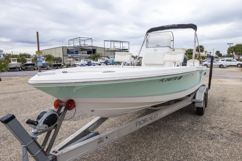 Slide: The Image of 2017 Robalo 206 Cayman boat on trailer in outdoor dealership lot. - 15