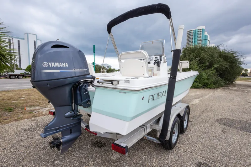 Slide: The Image of 2017 Robalo 206 Cayman boat with Yamaha engine on trailer, parked outdoors. - 20