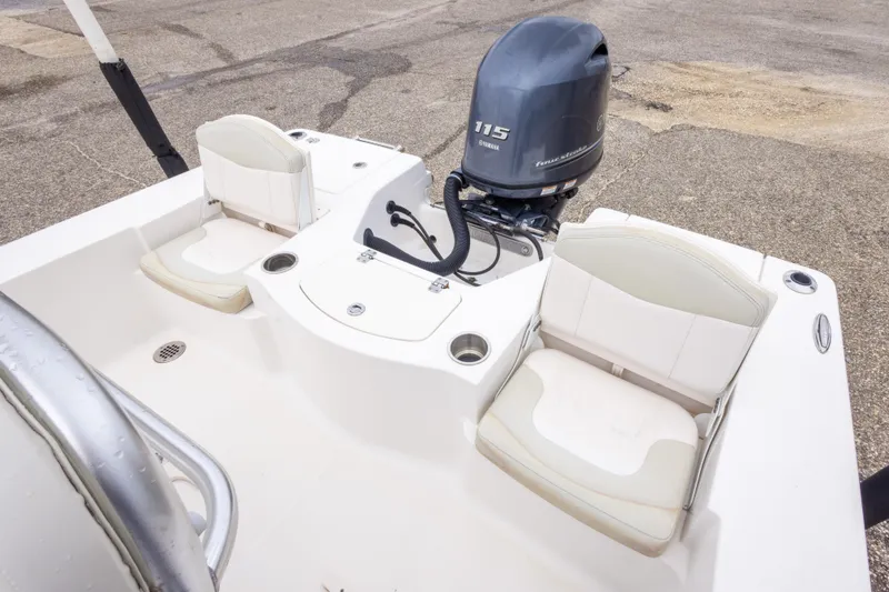 Slide: The Image of 2017 Robalo 206 Cayman boat interior with Yamaha 115 engine, featuring comfortable seating. - 28