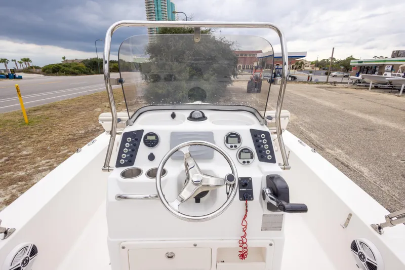 Slide: The Image of 2017 Robalo 206 Cayman boat dashboard with steering wheel and control panel. - 29