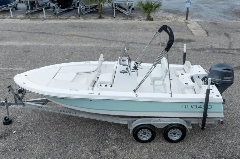 Slide: The Image of 2017 Robalo 206 Cayman boat on trailer, parked outdoors, side view. - 7