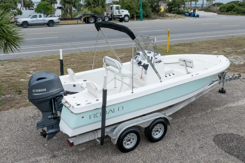 Slide: The Image of 2017 Robalo 206 Cayman boat on trailer with Yamaha outboard motor, parked roadside. - 9