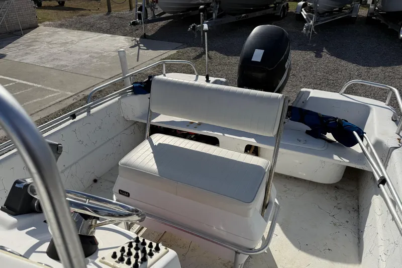 Slide: The Image of 2006 Carolina Skiff 1980 DLX boat interior with seating and steering wheel. - 18
