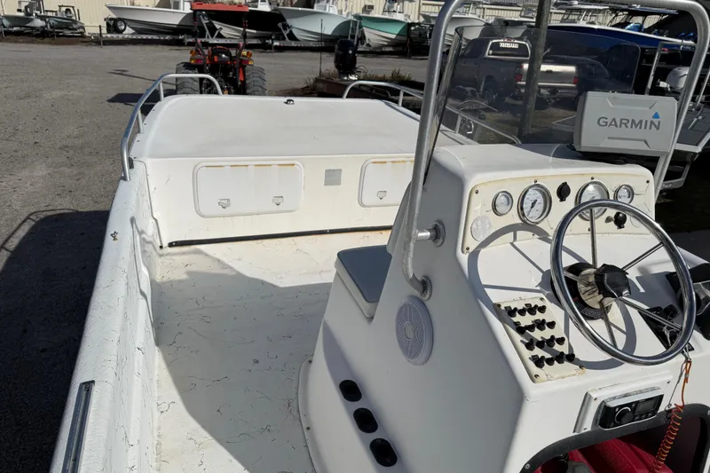 Slide: The Image of 2006 Carolina Skiff 1980 DLX boat interior with steering console and Garmin navigation system. - 24