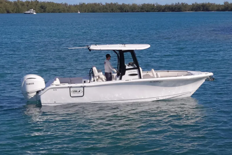 The Image of 2025 Sea Hunt Ultra 255 SE boat on calm water. - 0