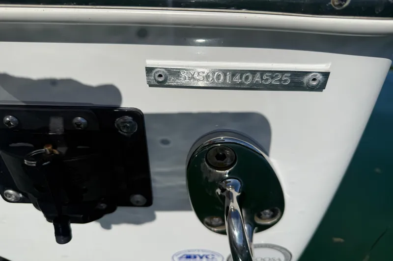 Slide: The Image of 2025 Sea Hunt Ultra 255 SE boat hull identification number plate. - 13