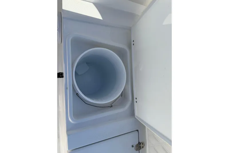 Slide: The Image of Open storage compartment on 2025 Sea Hunt Ultra 255 SE boat. - 15
