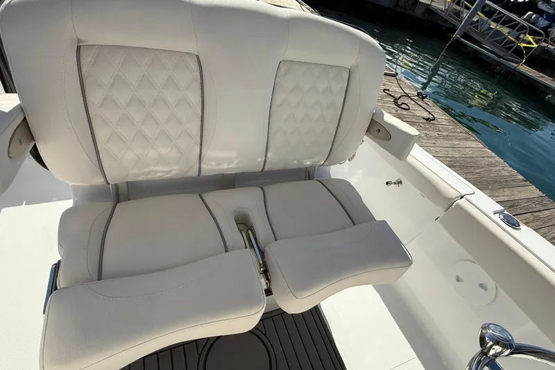 Slide: The Image of Luxurious seating on 2025 Sea Hunt Ultra 255 SE boat at dockside. - 17