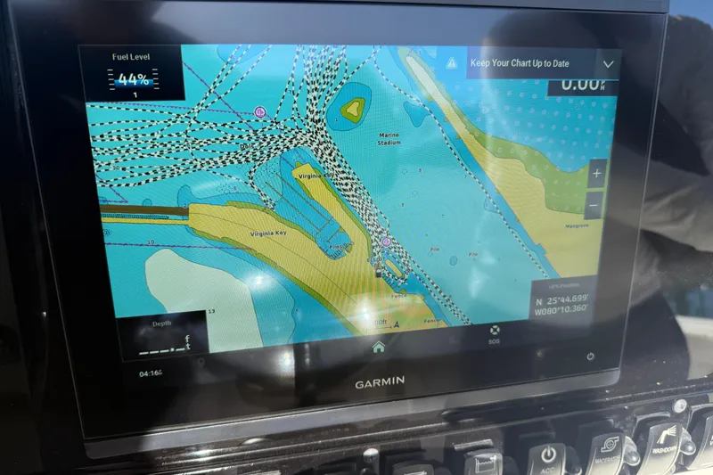 Slide: The Image of Garmin navigation display on 2025 Sea Hunt Ultra 255 SE, showing marine chart and fuel level. - 19