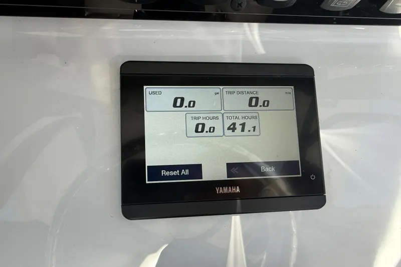 Slide: The Image of Yamaha display on 2025 Sea Hunt Ultra 255 SE showing trip and usage data. - 21